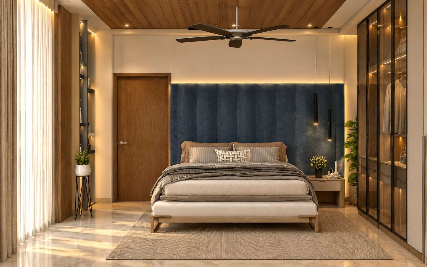 A bedroom with a navy panelled headboard wall and soft lighting