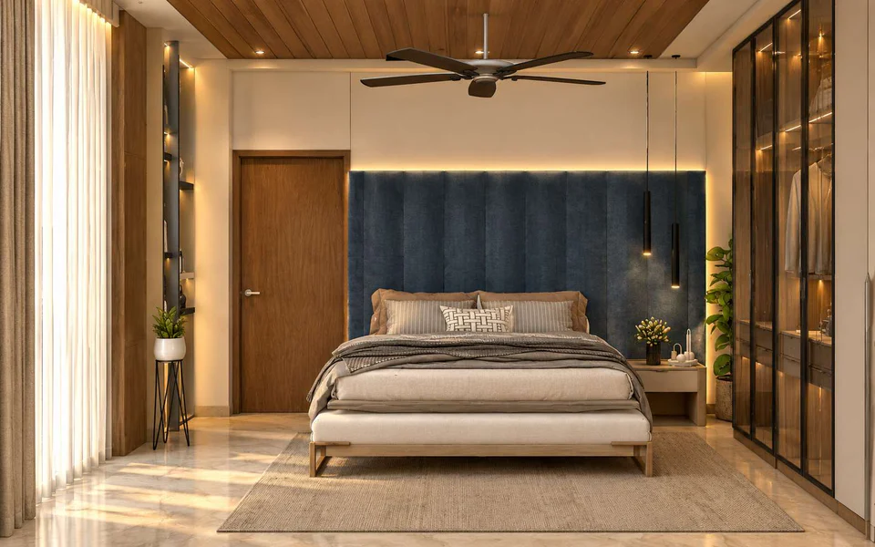 Bedroom with a navy fluted headboard wall, timber ceiling and a ceiling fan